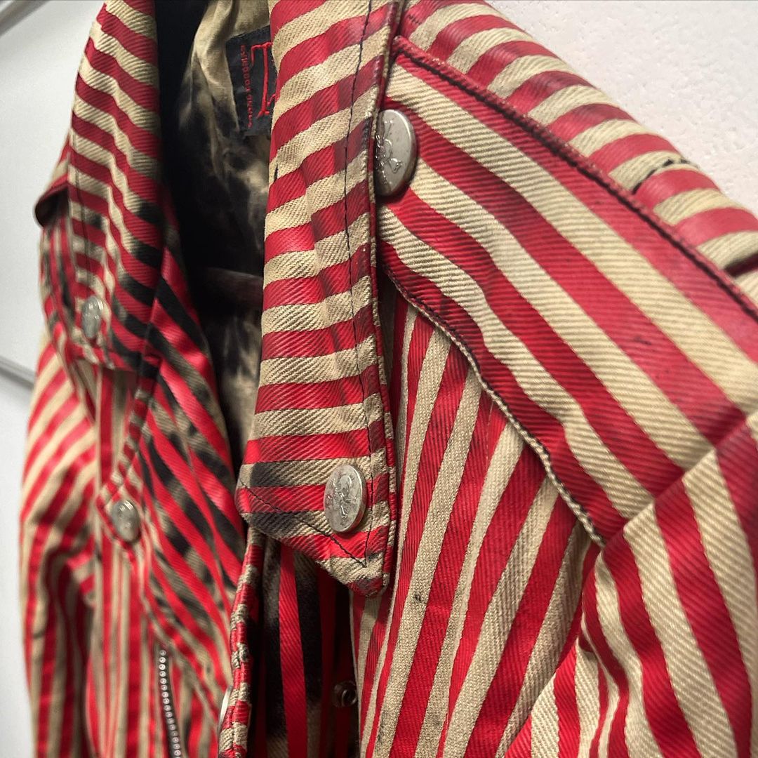 Closeup of Johnny's red striped jacket