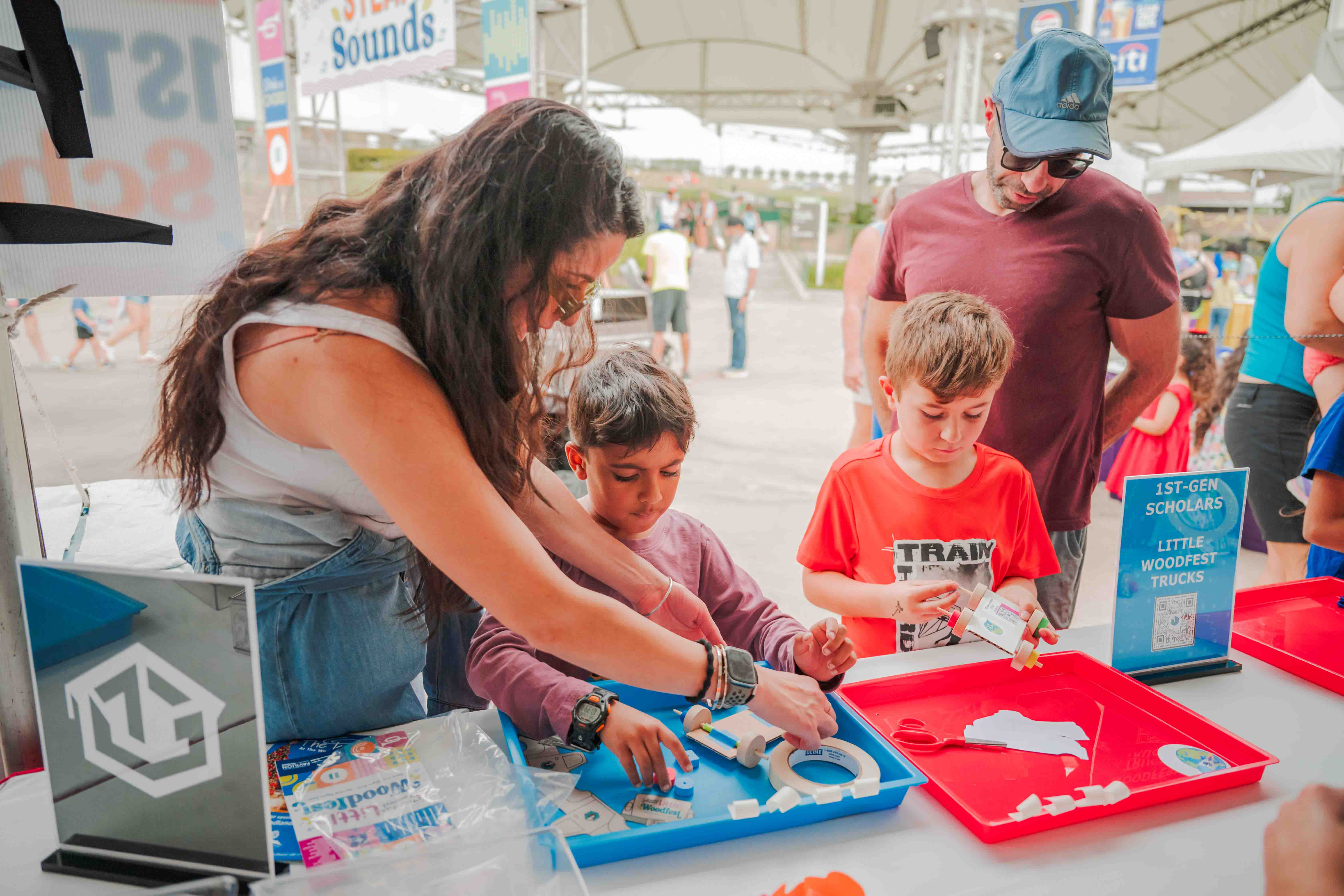 Children work together on a colorful hands-on festival challenge.