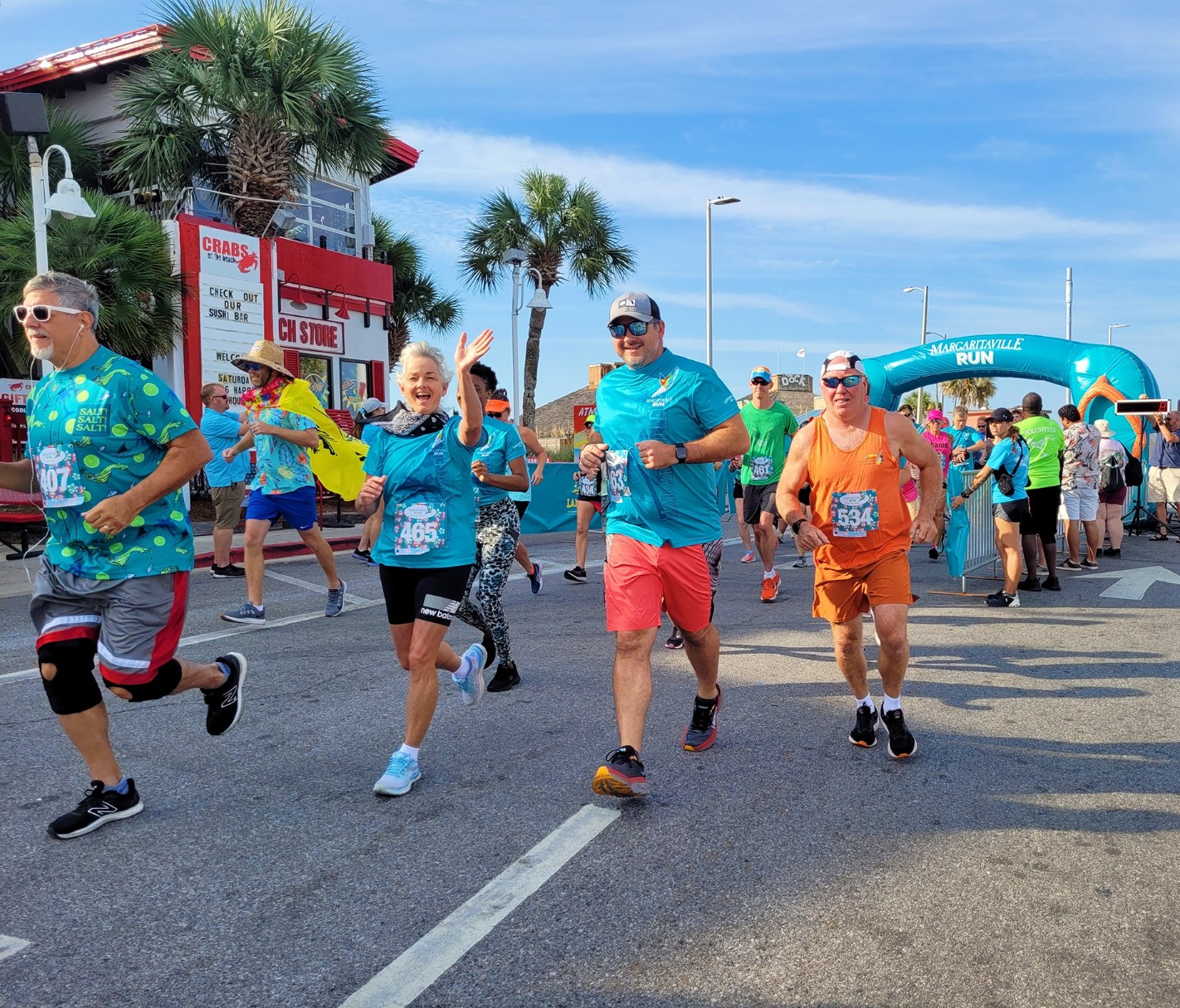 A group of people are participating in a MARGARITAVILLE RUN