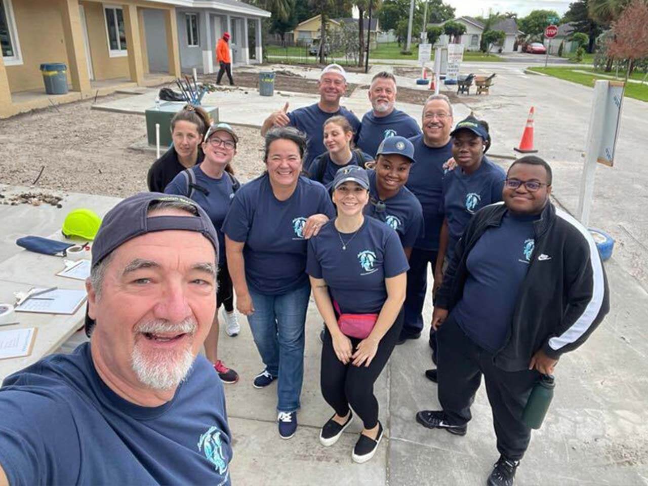 Large group of people from All Hands and Hearts smiling