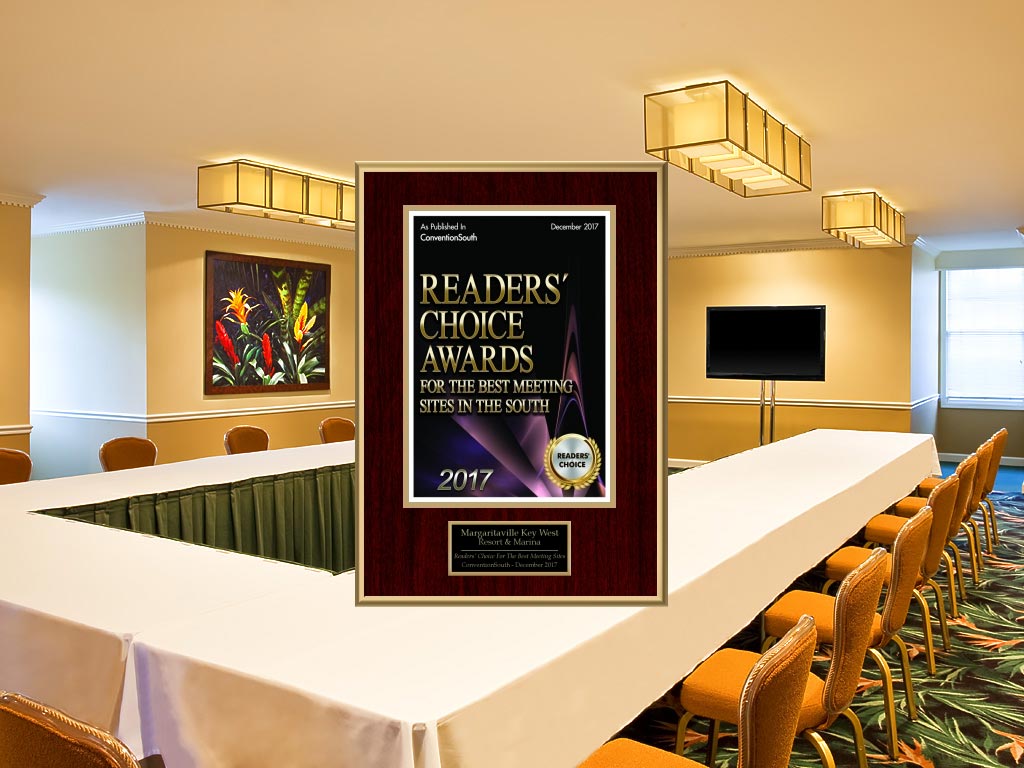 Meeting Space with a large table, chairs, TV and the plate Readers Choice Awards