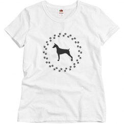 Doberman with dog paws around it