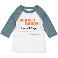 Toddler football player in training