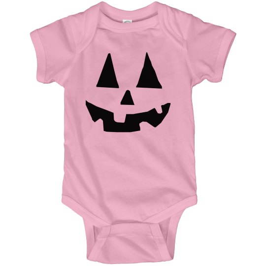 Halloween Jack O Lantern face infant pink onesie. 